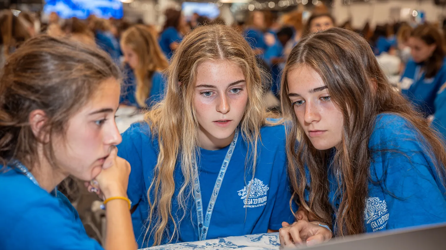 High school students working on laptops