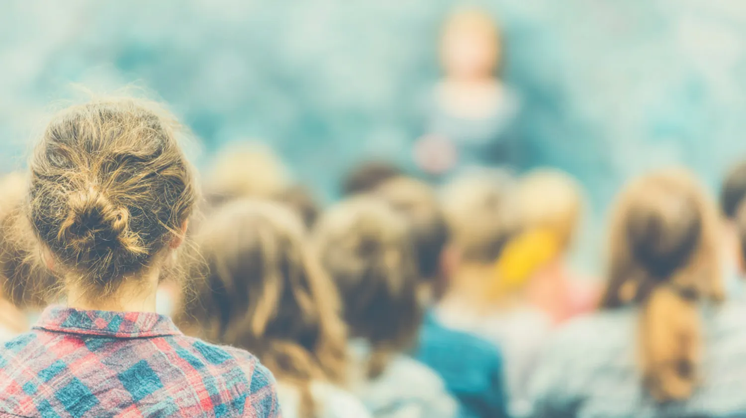 Teacher working with students in classroom